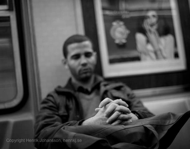 Man is resting on subway (picture taken with Canon EOS 5D Mark II and Canon EF 50mm f/1,4 USM )