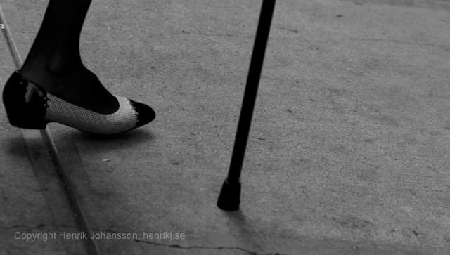 Old lady in fancy shoes with cane (picture taken with Canon EOS 5D Mark II and Canon EF 135mm f/2 L USM )