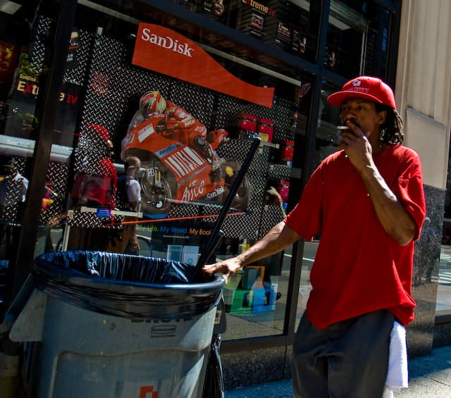 Guy with garbage can wears red and smokes (picture taken with Canon EOS 1D Mark III and Canon EF 16-35mm f/2,8 L USM)