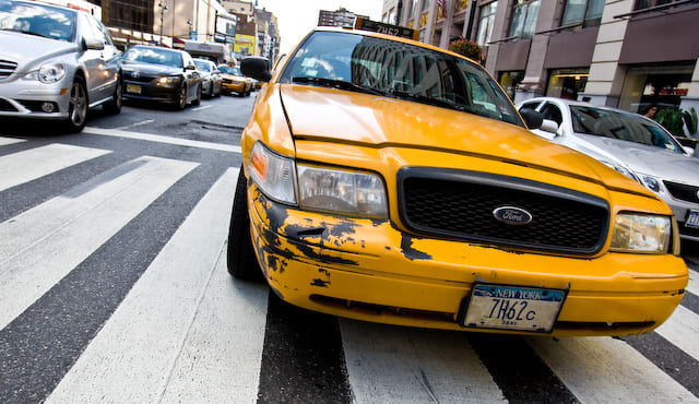 Yellow cab with damaged bumber (picture taken with Canon EOS 1D Mark III and Canon EF 16-35mm f/2,8 L USM)